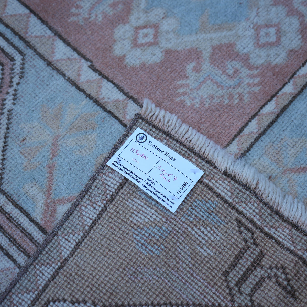 Beige 4' x 7' vintage Turkish wool rug from the 1970s with traditional design.