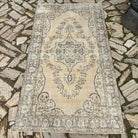 Blue 4' x 7' vintage Turkish wool rug in wool and cotton, shown on the floor.