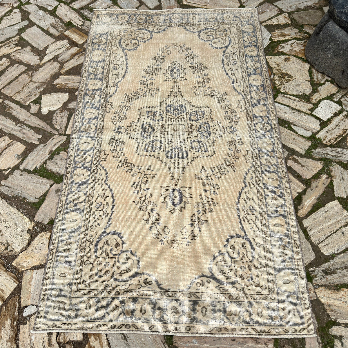 Blue 4' x 7' vintage Turkish wool rug in wool and cotton, shown on the floor.