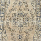 1970s blue vintage Turkish wool rug with medallion design, hand-knotted weave and low pile.