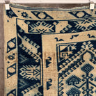 Blue 4' x 7' vintage Turkish wool rug in wool and cotton, shown on the floor.