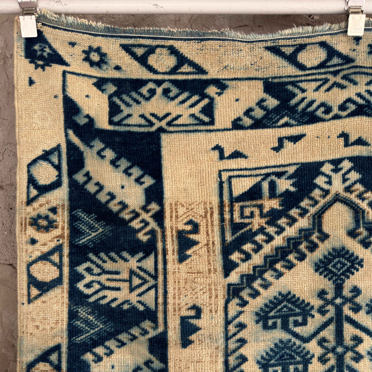 Blue 4' x 7' vintage Turkish wool rug in wool and cotton, shown on the floor.