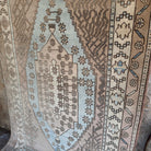 Blue 4' x 7' vintage Turkish wool rug in wool and cotton, shown on the floor.