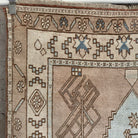 1970s blue vintage Turkish wool rug with neutral design, hand-knotted weave and low pile.