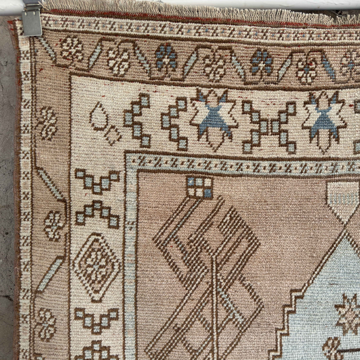 1970s blue vintage Turkish wool rug with neutral design, hand-knotted weave and low pile.