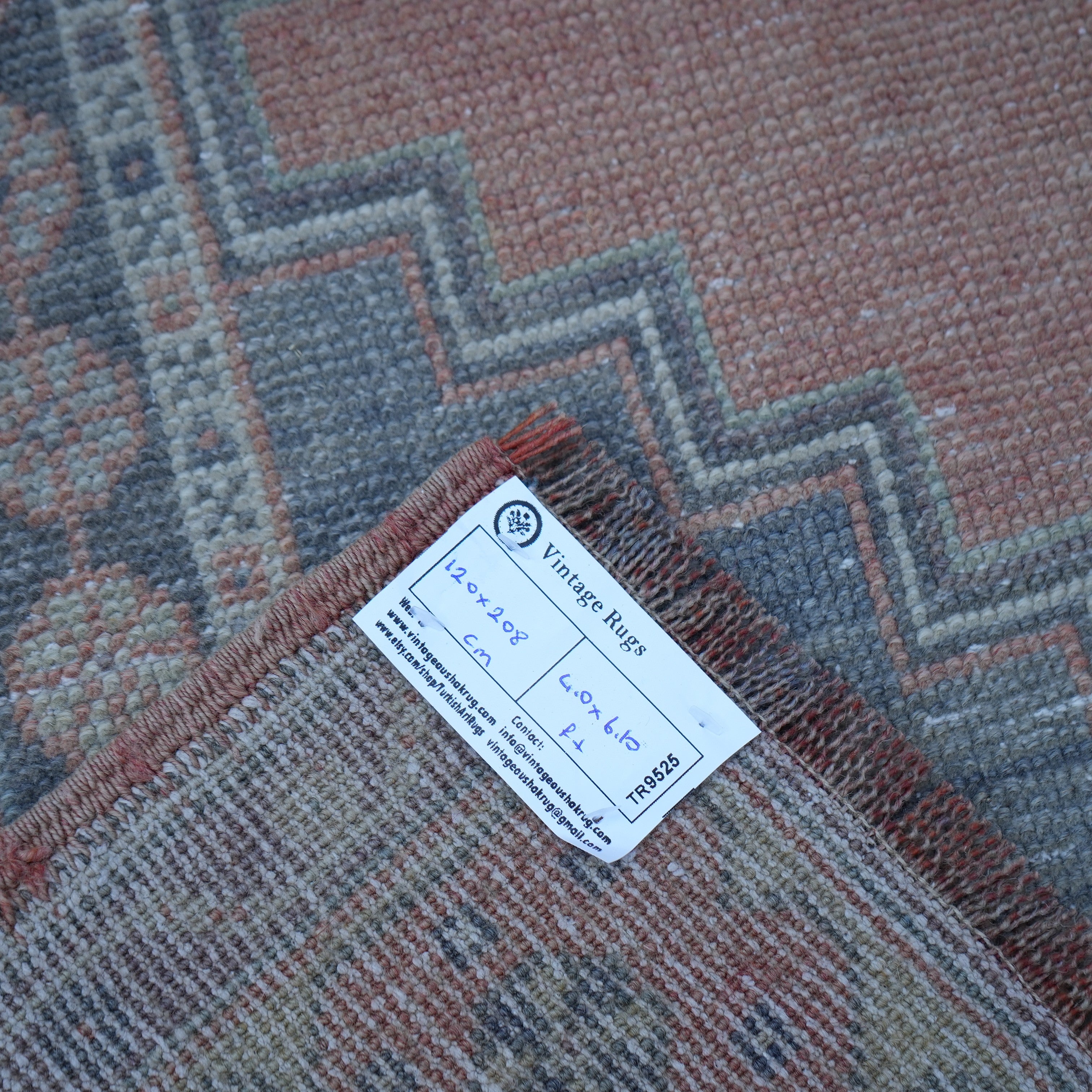 Orange 4' x 7' vintage Turkish wool rug from the 1970s with traditional design.