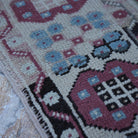Pale Purple 4' x 7' vintage Turkish wool rug in wool, shown on the floor.