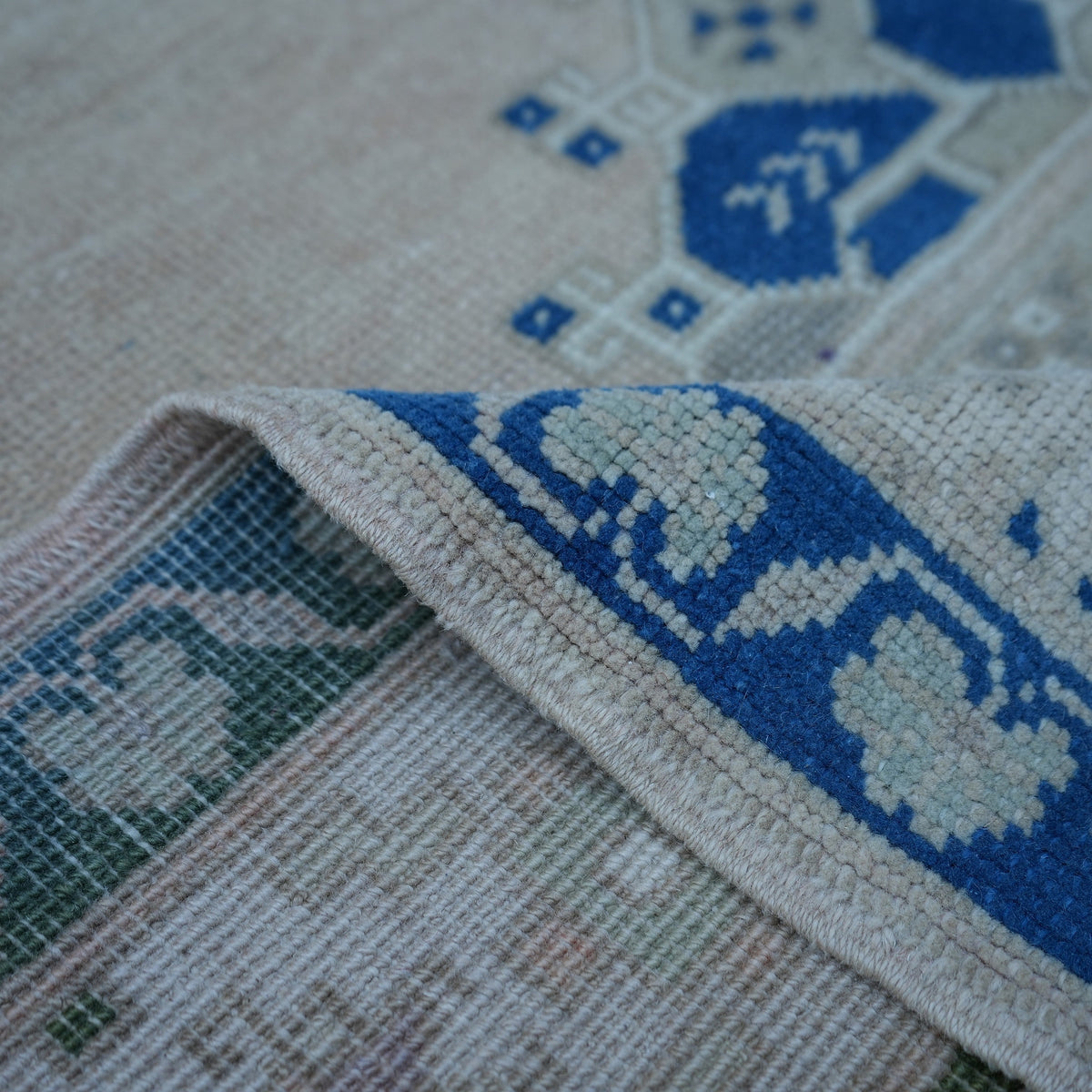 Additional view of the blue vintage Turkish wool rug, hand-knotted in wool.