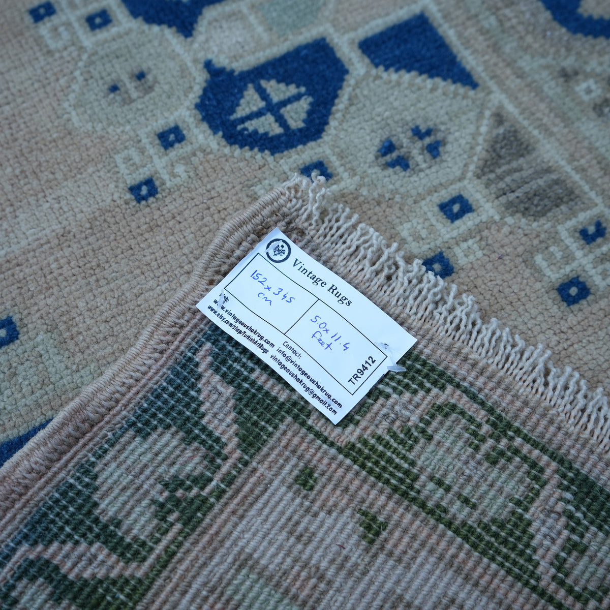 Blue 5' x 11' vintage Turkish wool rug from the 1970s with medallion design.
