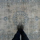 1970s blue vintage Turkish wool rug with medallion design, hand-knotted weave and low pile.
