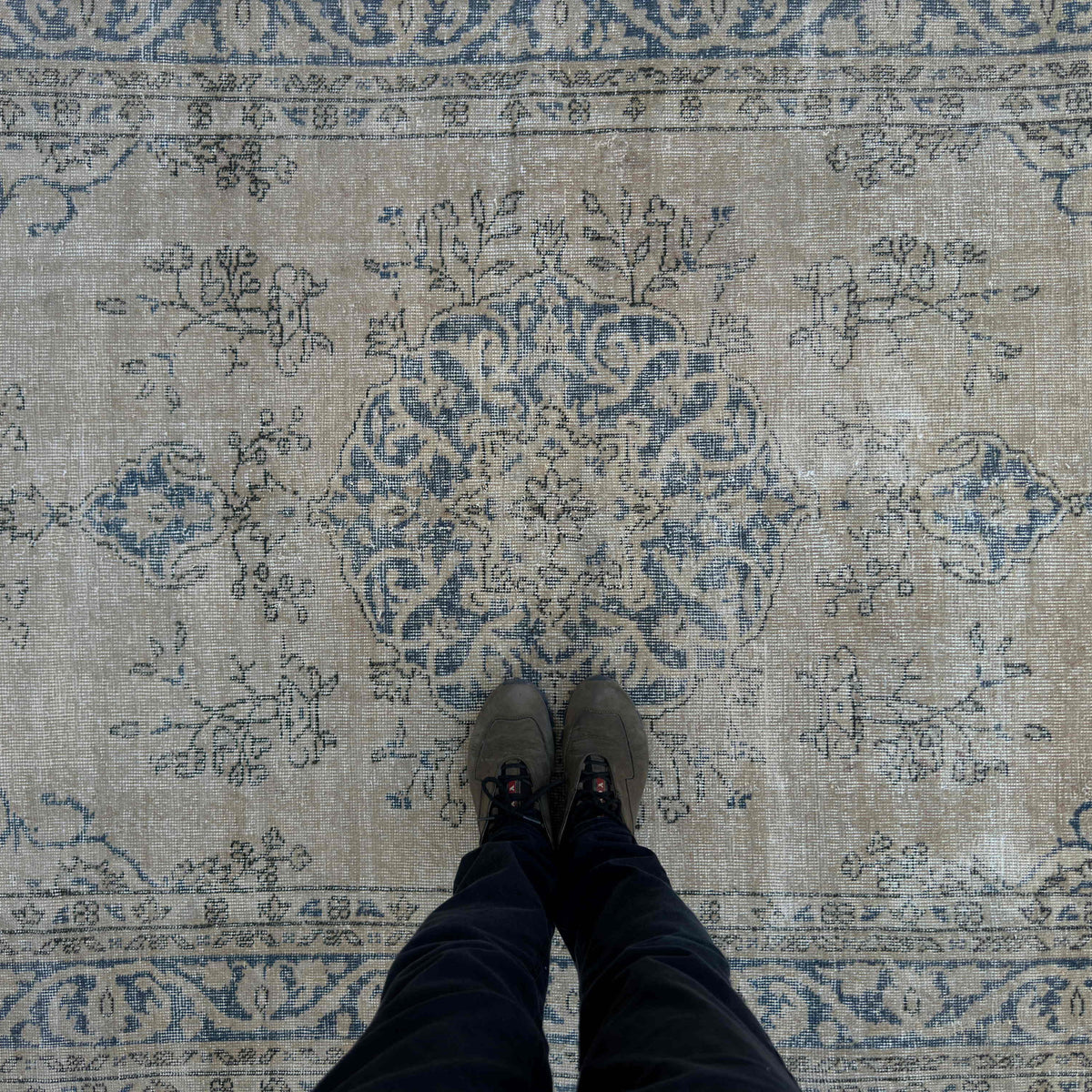 1970s blue vintage Turkish wool rug with medallion design, hand-knotted weave and low pile.
