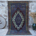 Purple 5' x 9' vintage wool rug with traditional design, handmade in Turkey – Candis.