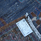 Purple 5' x 9' vintage Turkish wool rug from the 1970s with traditional design.