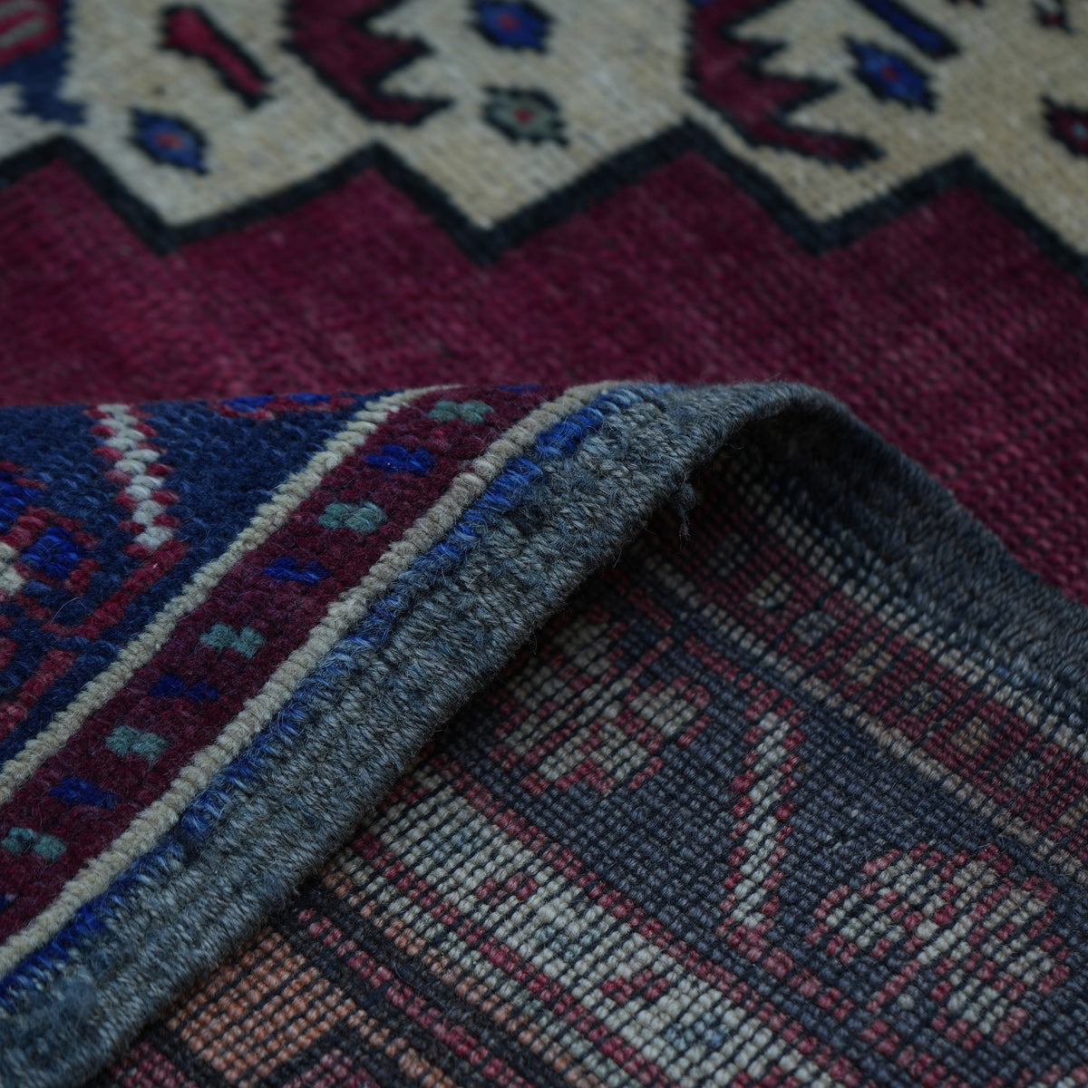 Additional view of the red vintage Turkish wool rug, hand-knotted in wool.