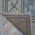 1970s pale blue vintage Turkish wool rug with geometric design, hand-knotted weave and low pile.