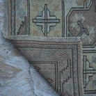 1970s beige vintage Turkish wool rug with neutral design, hand-knotted weave and low pile.