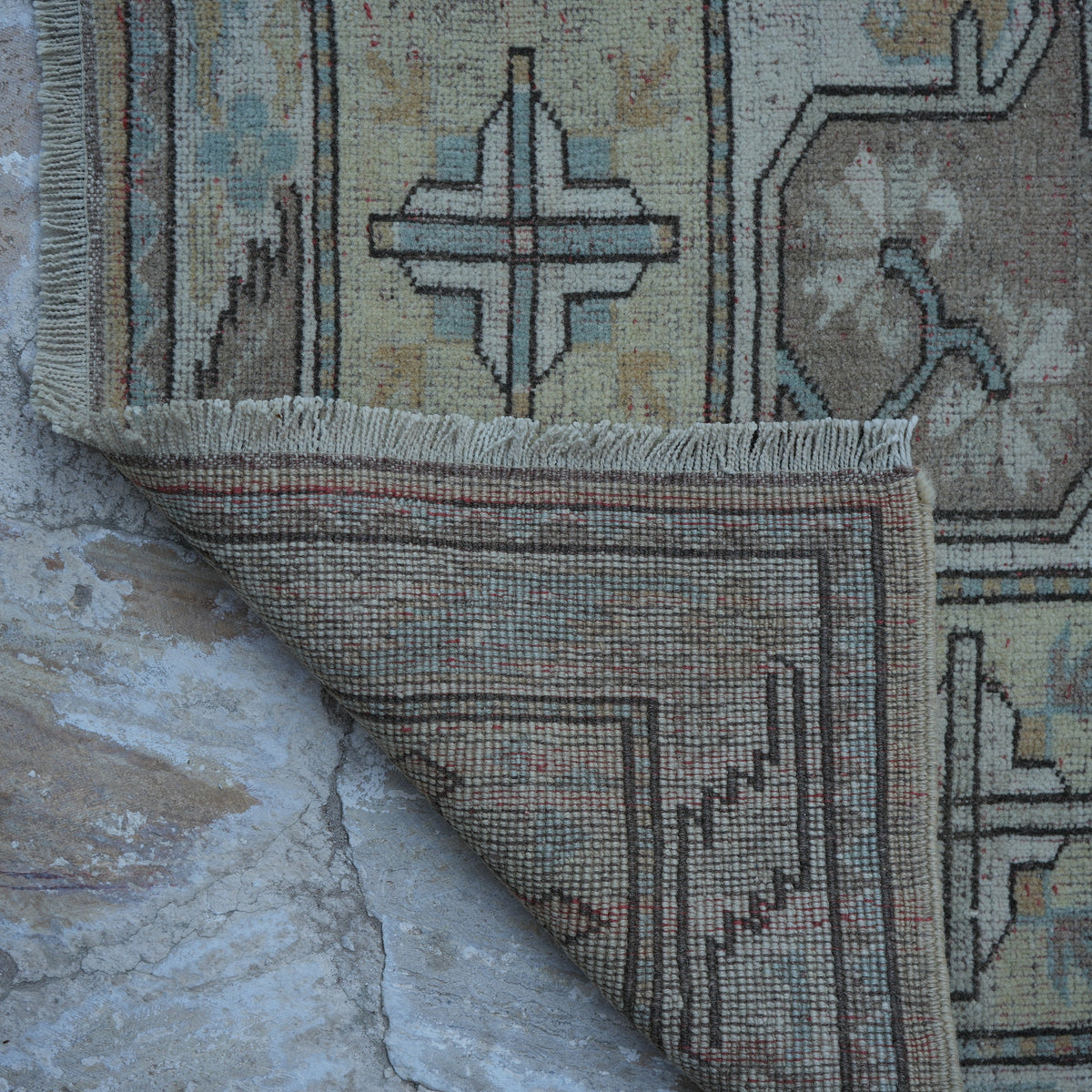 1970s beige vintage Turkish wool rug with neutral design, hand-knotted weave and low pile.