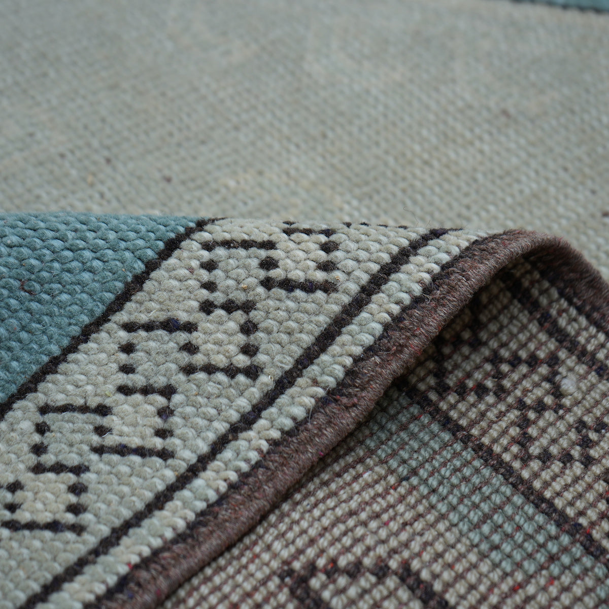 Additional view of the pale blue vintage Turkish wool rug, hand-knotted in wool.