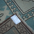 Pale Blue 7' x 10' vintage Turkish wool rug from the 1970s with geometric design.