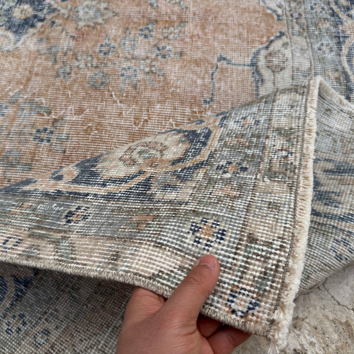 1970s orange vintage Turkish wool rug with medallion design, hand-knotted weave and low pile.