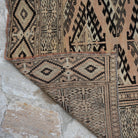 1970s pale orange vintage Turkish wool rug with neutral design, hand-knotted weave and low pile.