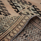 Additional view of the pale orange vintage Turkish wool rug, hand-knotted in wool.