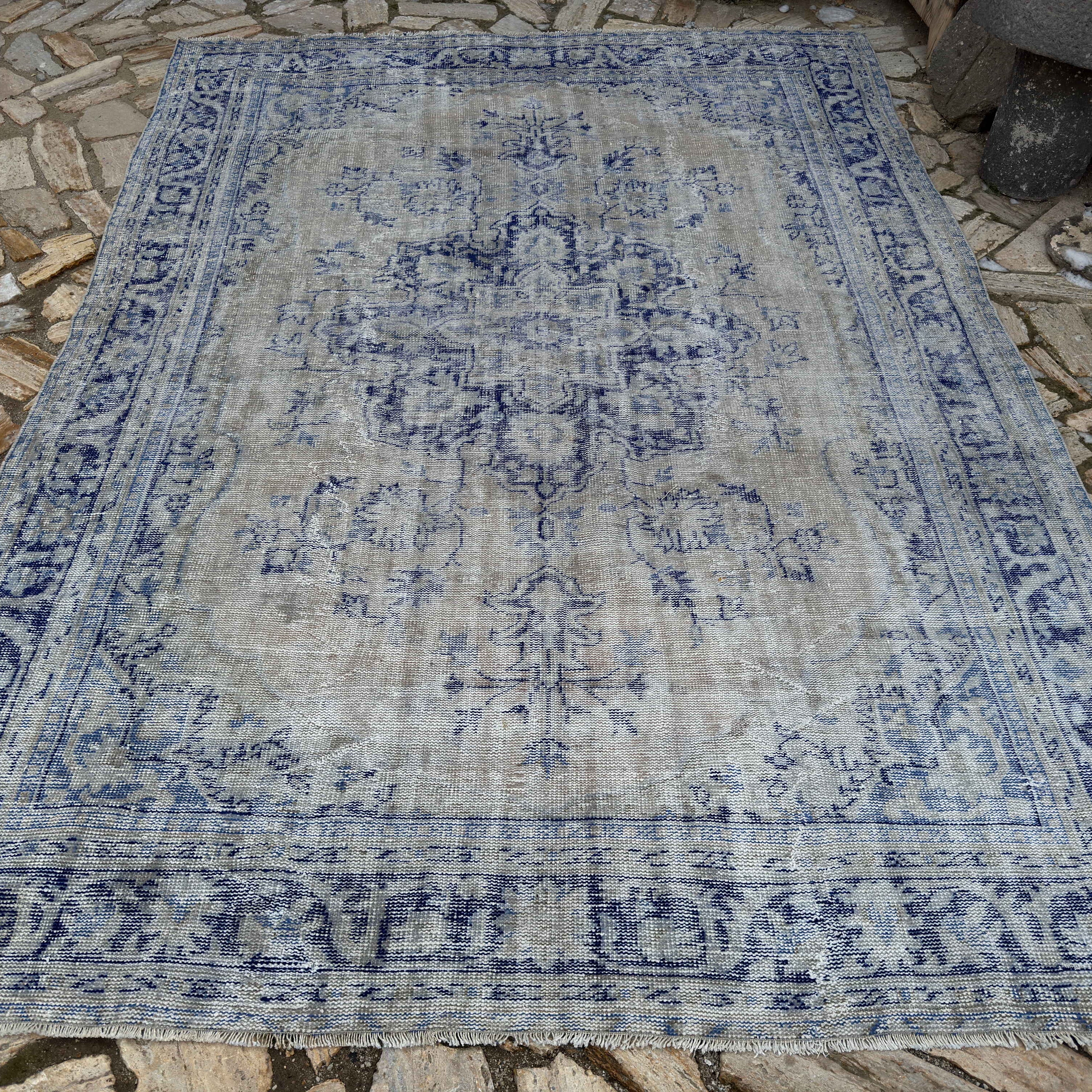 Pale Blue 7' x 10' Turkish wool distressed carpet in wool and cotton, shown on the floor.