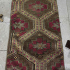Close-up of the brown Turkish wool kilim rug showing traditional details, flatweave construction, wool and cotton and low pile.