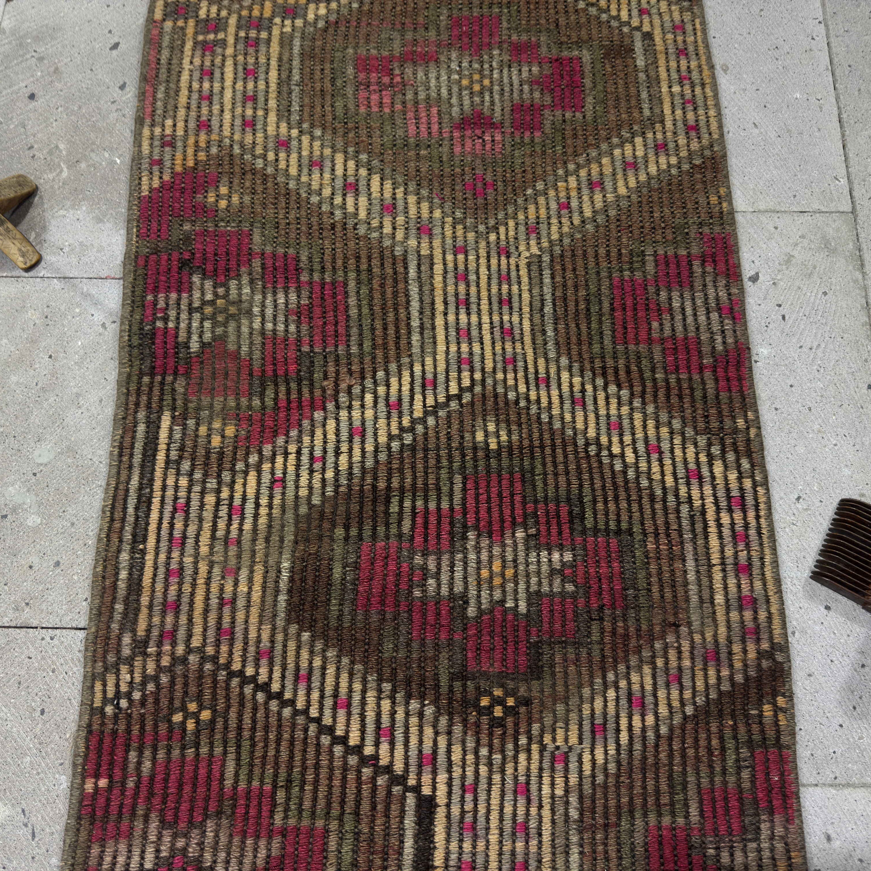 Close-up of the brown Turkish wool kilim rug showing traditional details, flatweave construction, wool and cotton and low pile.
