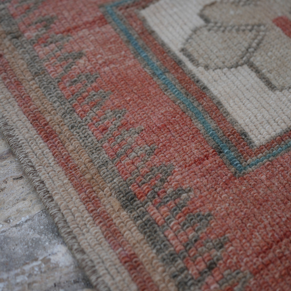 Red 3' x 9' Turkish wool runner rug in wool, shown on the floor.