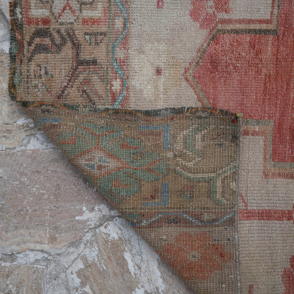 1970s red Turkish wool runner rug with traditional design, hand-knotted weave and low pile.