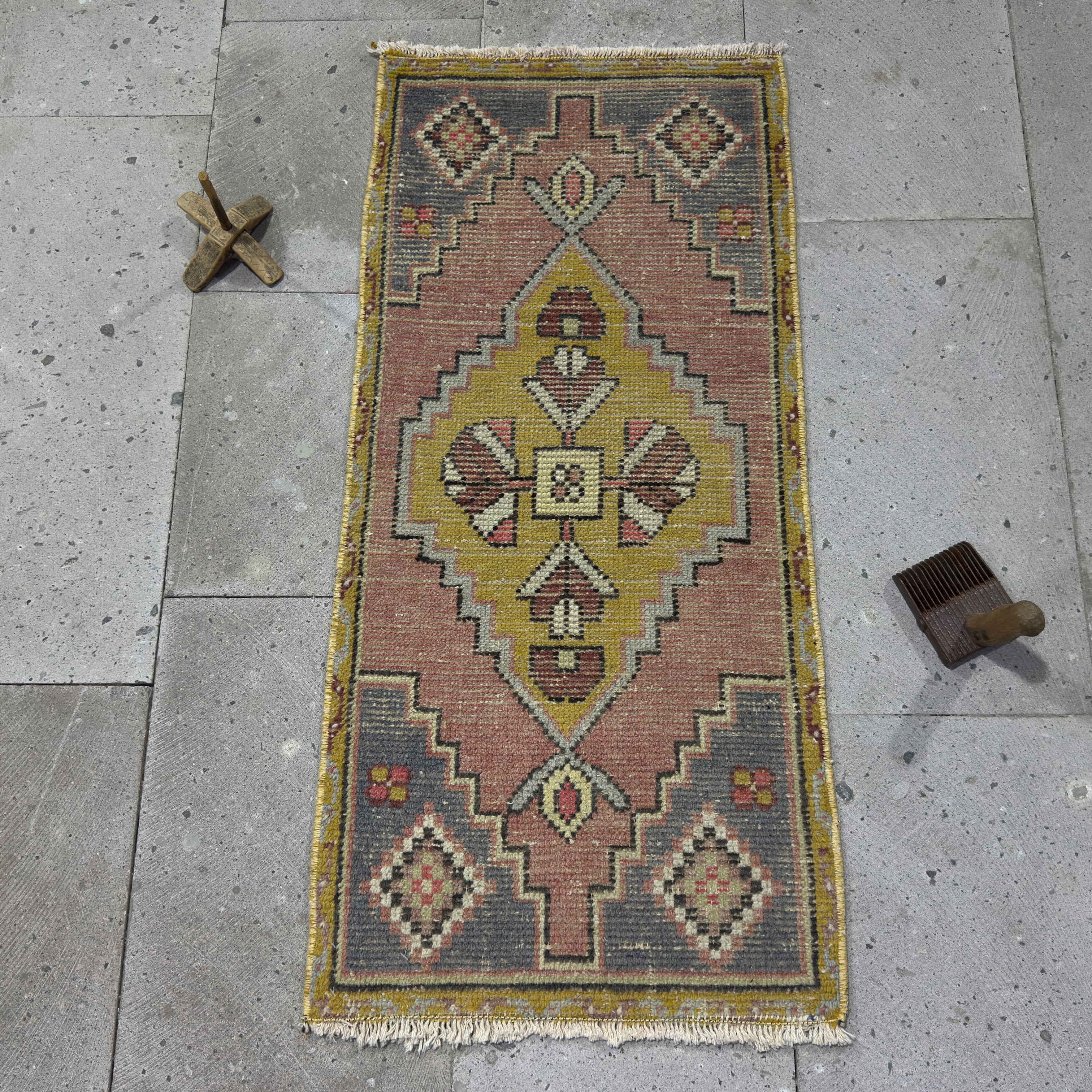 Yellow 2' x 3' Turkish wool traditonal rug in wool and cotton, shown on the floor.