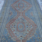 Close-up of the blue wool turkish rug showing traditional details, hand-knotted weave, wool and low pile.