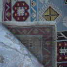 1970s blue Turkish wool vintage rug with geometric design, hand-knotted weave and low pile.