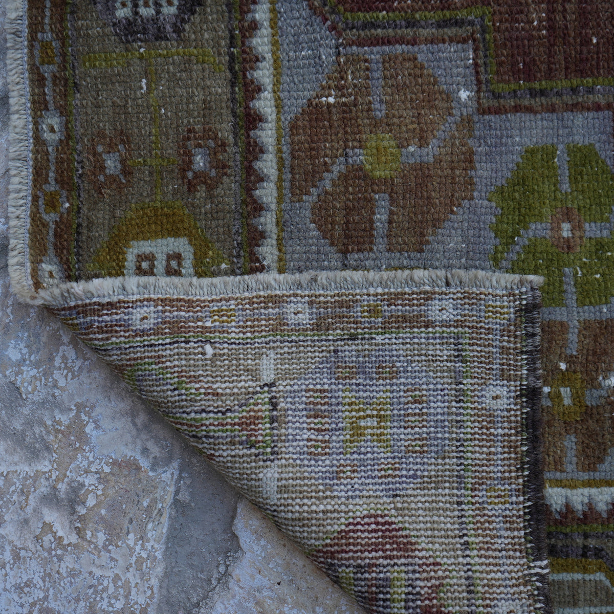 1970s brown Turkish wool vintage rug with traditional design, hand-knotted weave and low pile.