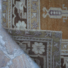 1970s warm brown Turkish wool vintage rug with neutral design, hand-knotted weave and low pile.