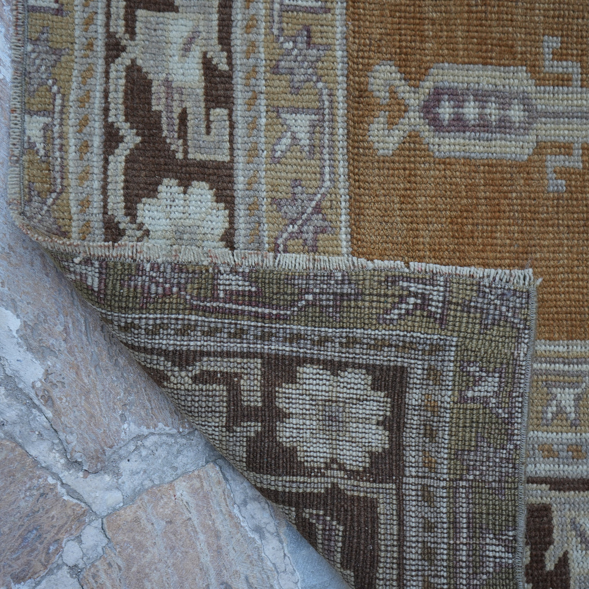 1970s warm brown Turkish wool vintage rug with neutral design, hand-knotted weave and low pile.