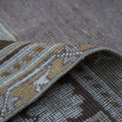 Additional view of the warm brown Turkish wool vintage rug, hand-knotted in wool.