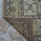 1970s yellow Turkish wool vintage rug with geometric design, hand-knotted weave and low pile.